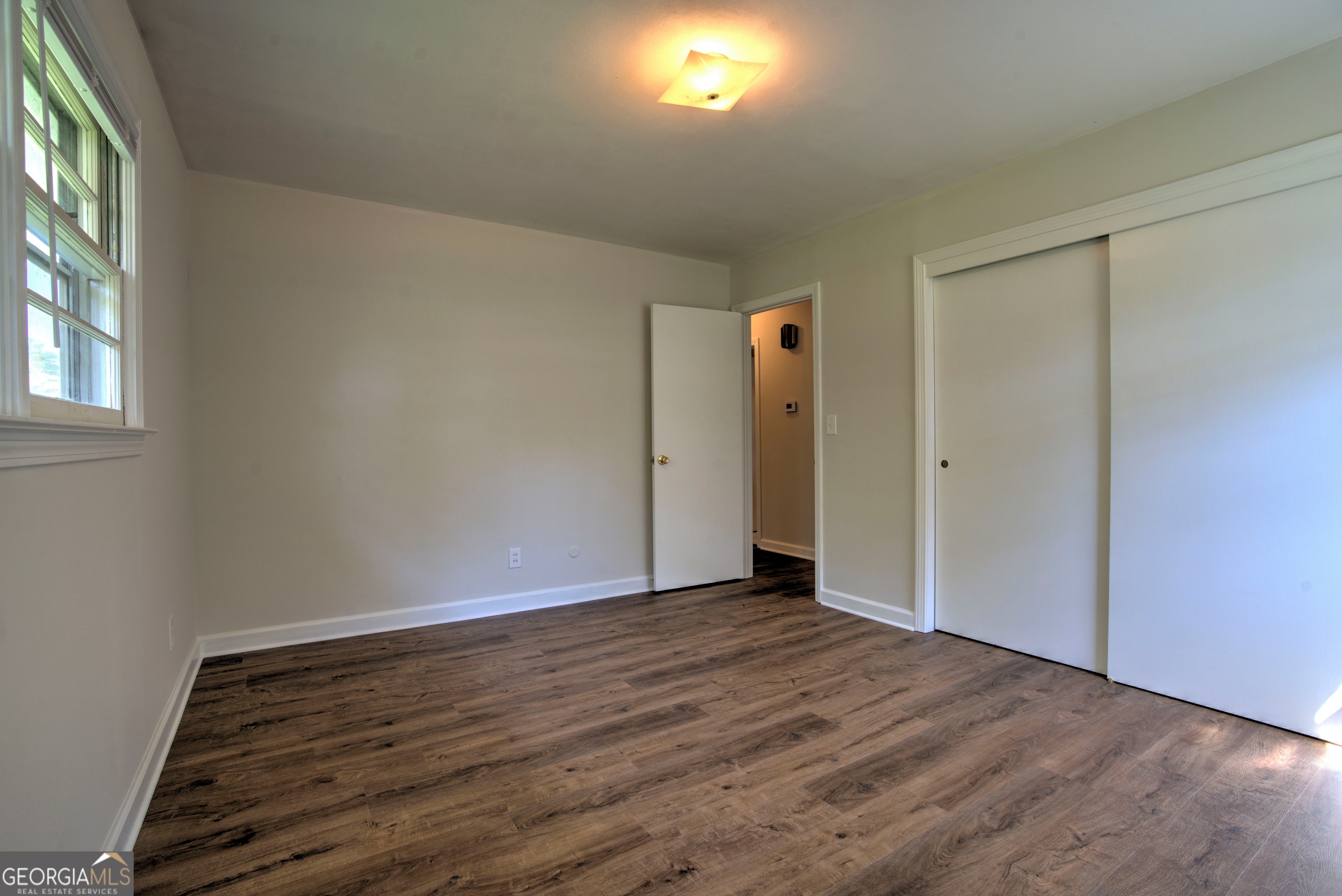25 Ridge Drive Southwest Rome, GA 30165 - Photo 15 of 37 an empty room with wooden floor and windows