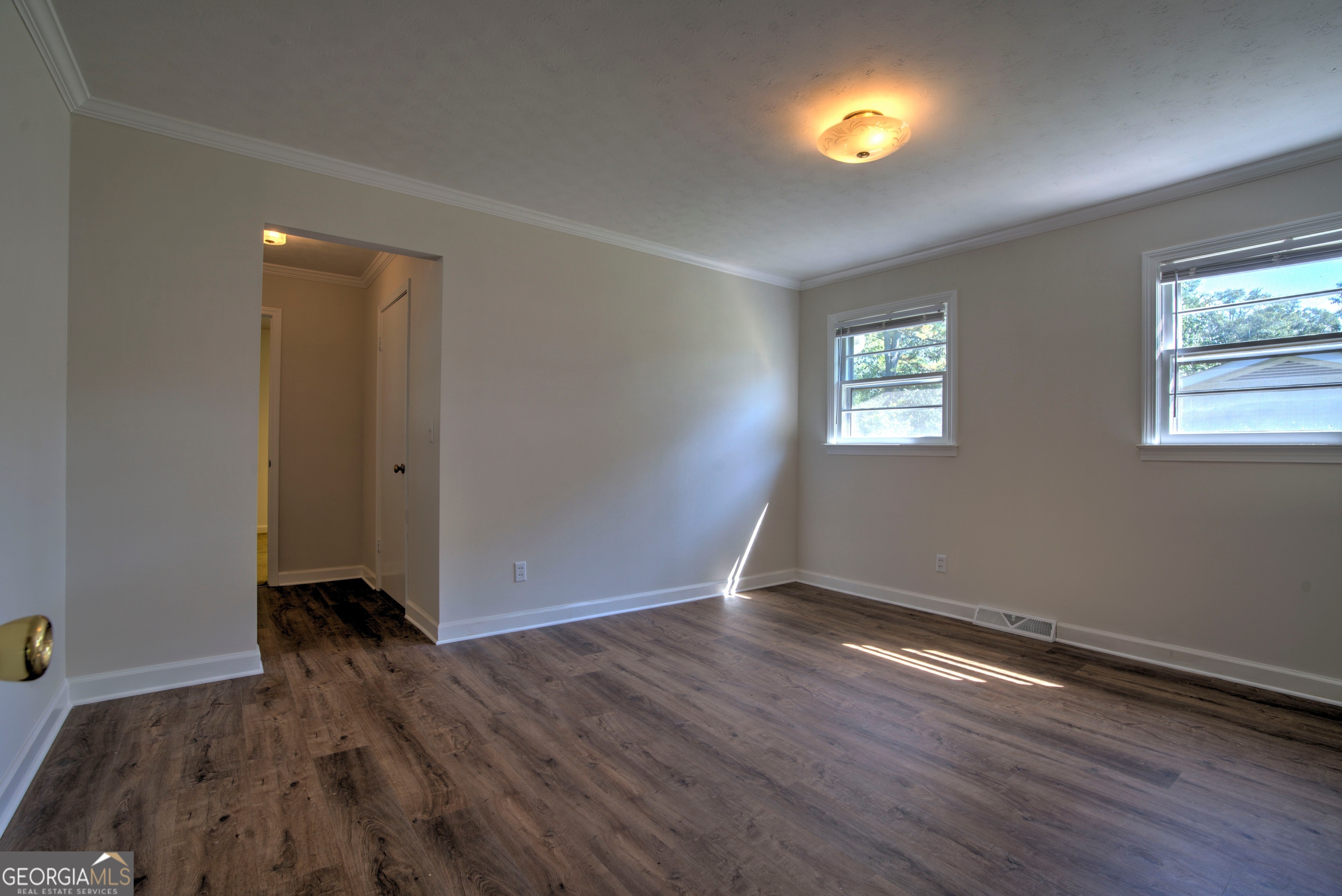 25 Ridge Drive Southwest Rome, GA 30165 - Photo 16 of 37 an empty room with wooden floor and windows