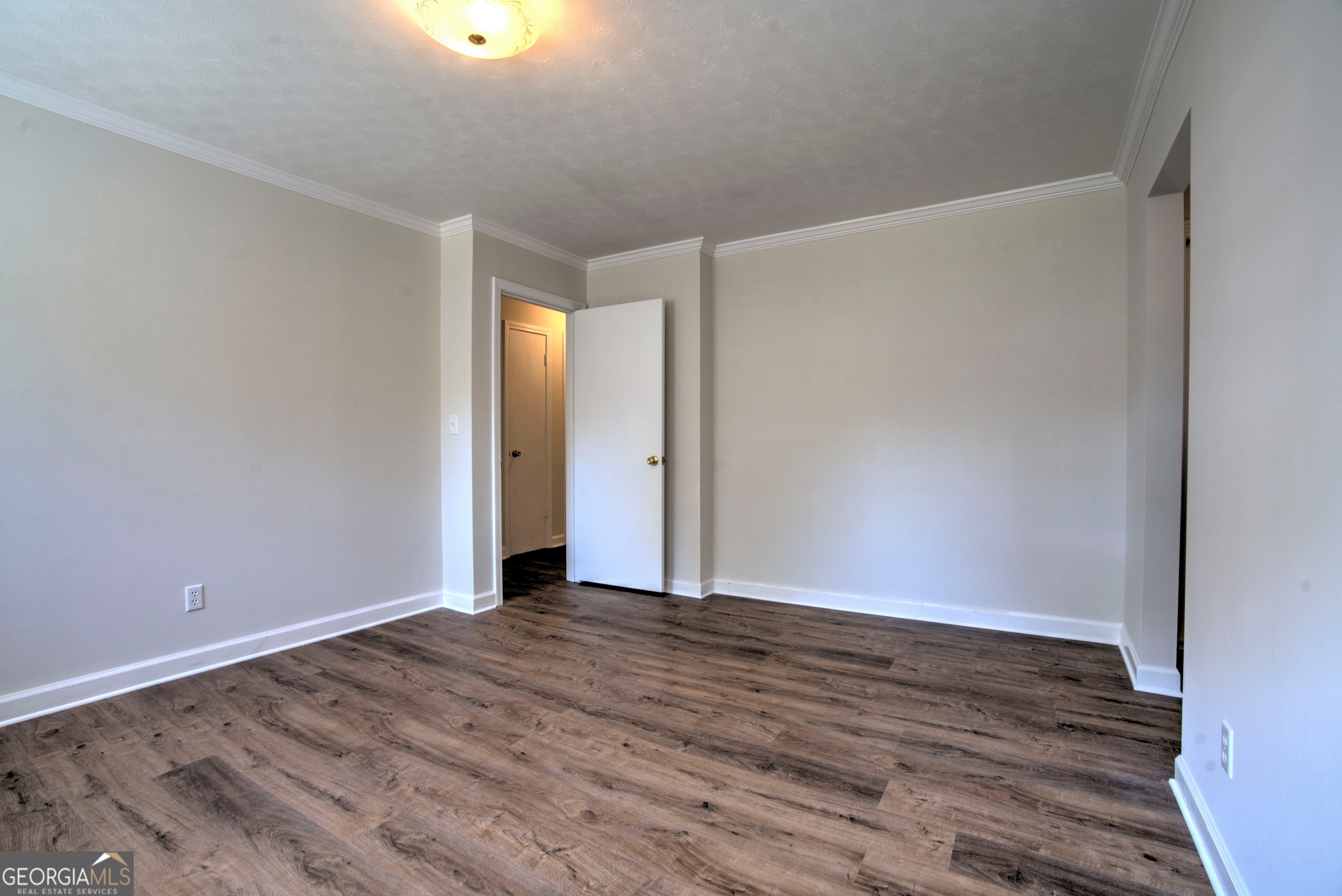 25 Ridge Drive Southwest Rome, GA 30165 - Photo 17 of 37 a view of an empty room with wooden floor