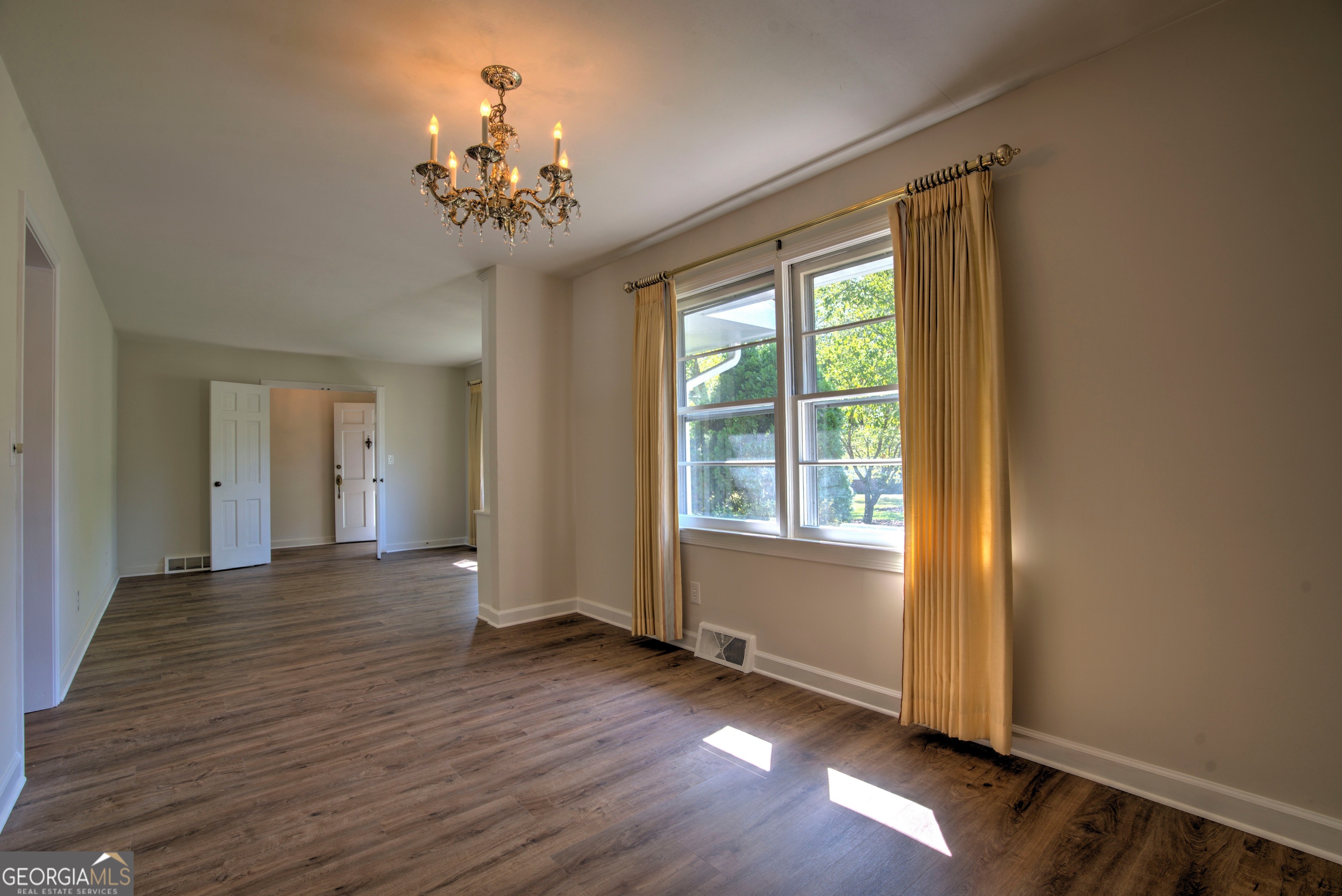 25 Ridge Drive Southwest Rome, GA 30165 - Photo 21 of 37 a view of an empty room with wooden floor and a window