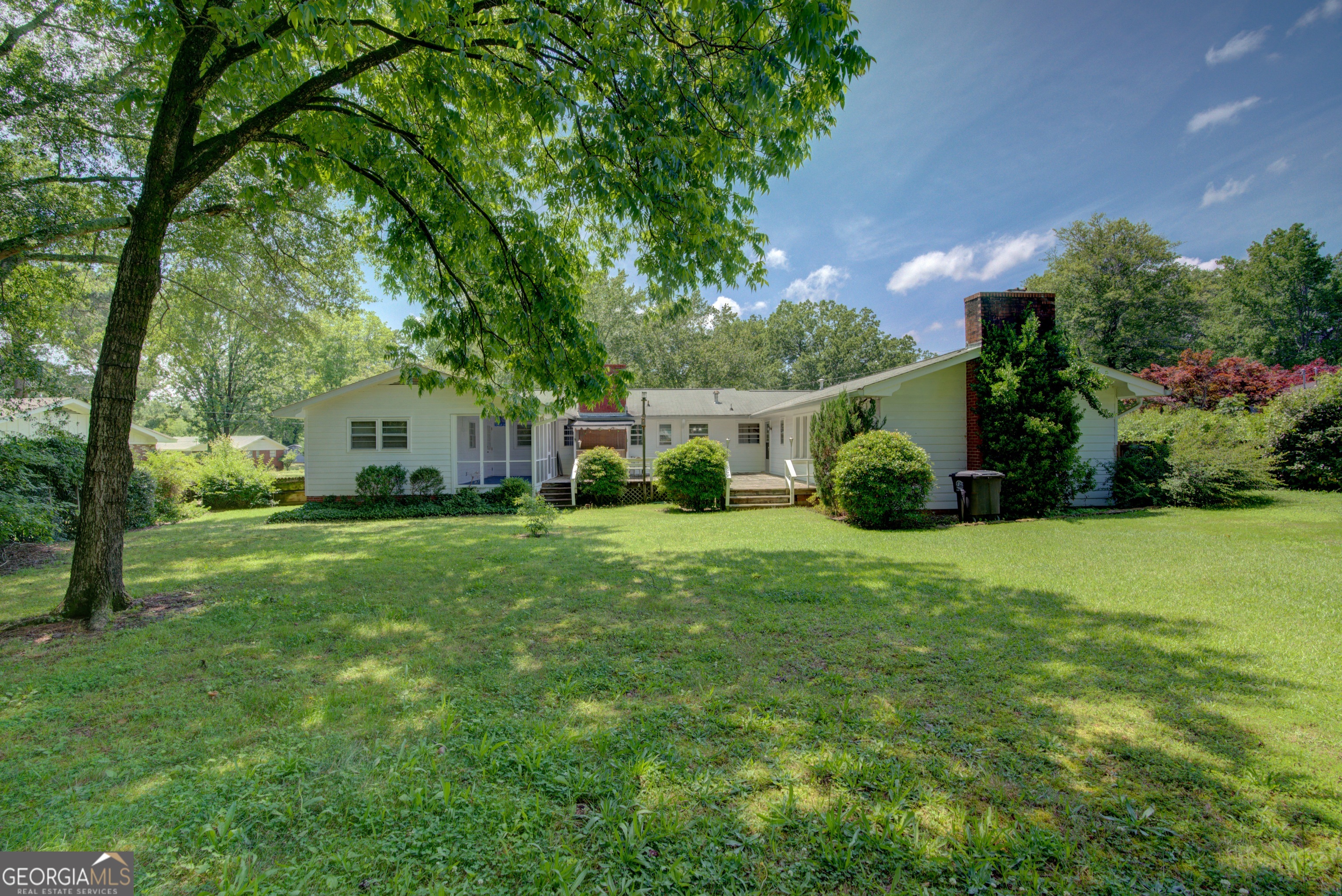 25 Ridge Drive Southwest Rome, GA 30165 - Photo 36 of 37 a view of a white house in front of a big yard with large trees