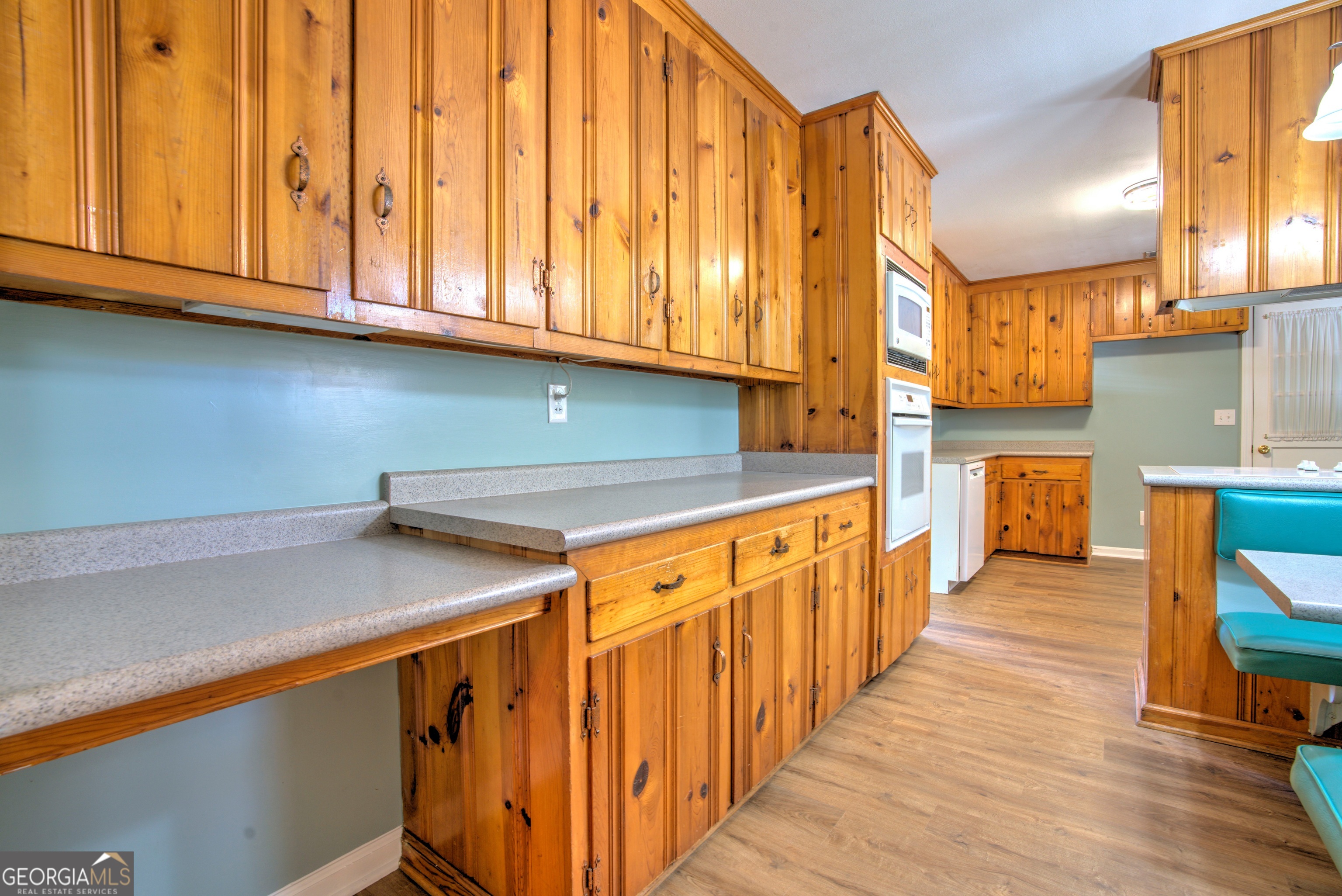 25 Ridge Drive Southwest Rome, GA 30165 - Photo 7 of 37 a kitchen with stainless steel appliances granite countertop a stove a sink and a microwave