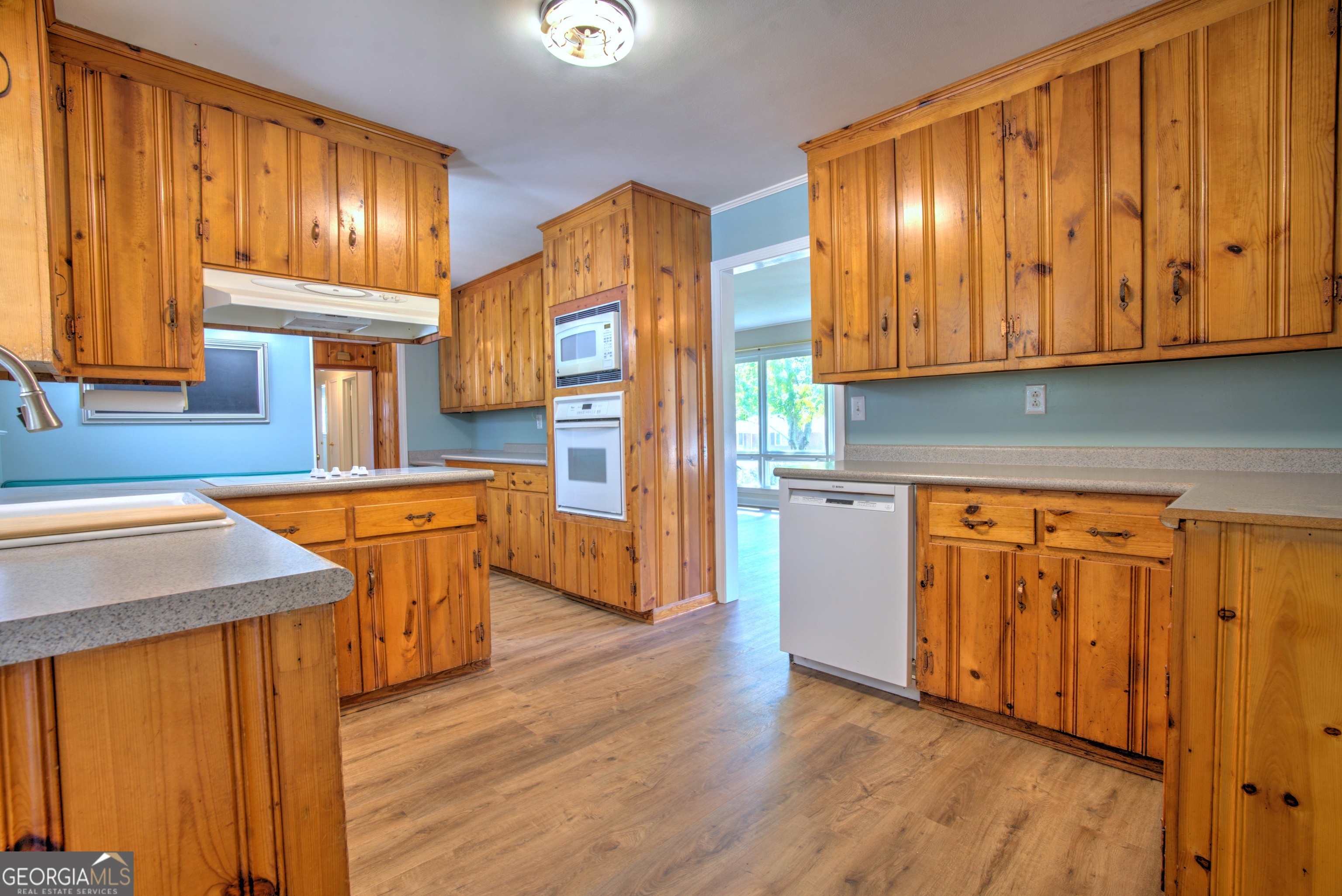 25 Ridge Drive Southwest Rome, GA 30165 - Photo 10 of 37 a kitchen with stainless steel appliances granite countertop wooden cabinets a refrigerator and sink