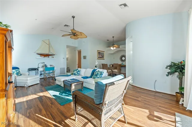 a view of a house with swimming pool and sitting area