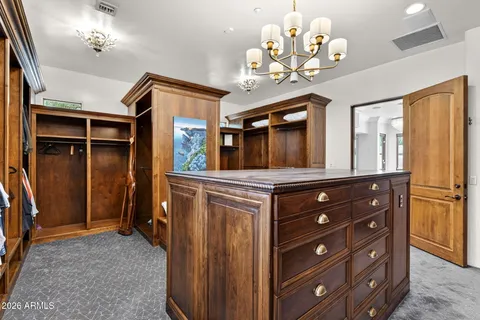 a bathroom with a granite countertop sink a toilet and shower