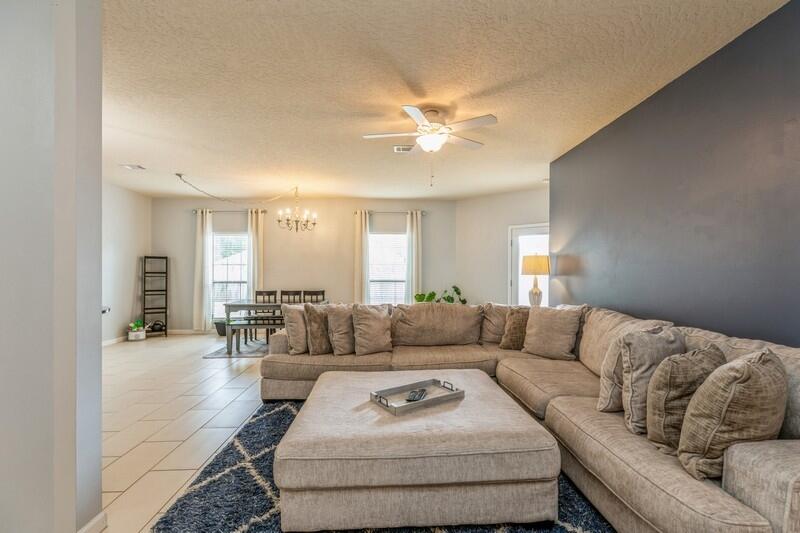 4596 Hermosa Road Crestview, FL 32539 - Photo 6 of 35 a living room with furniture and a couch
