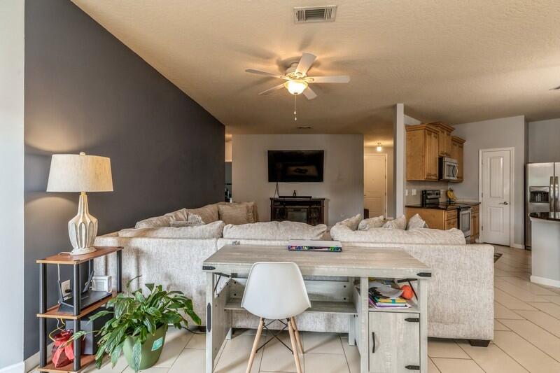 4596 Hermosa Road Crestview, FL 32539 - Photo 7 of 35 a view of a dining room with furniture and a chandelier