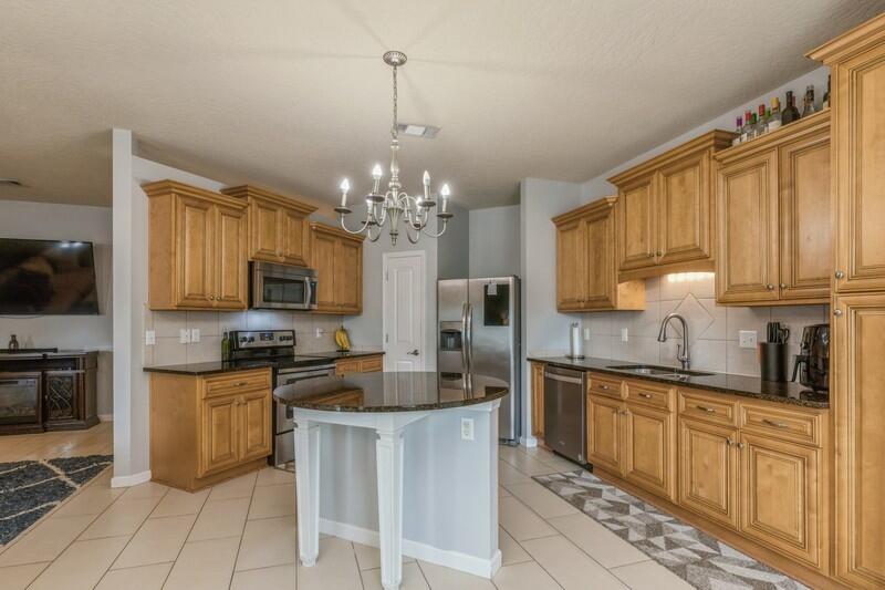 4596 Hermosa Road Crestview, FL 32539 - Photo 10 of 35 a kitchen with stainless steel appliances a sink stove and refrigerator
