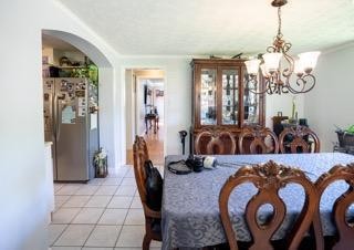 123 Manchester Road Oak Ridge, TN 37830 - Photo 11 of 26 a view of a dining room with furniture and chandelier