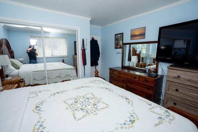123 Manchester Road Oak Ridge, TN 37830 - Photo 16 of 26 a bed room with a bed and a television