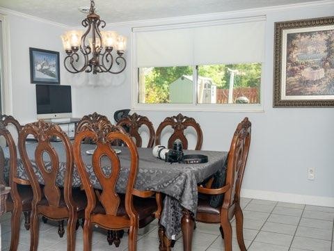 123 Manchester Road Oak Ridge, TN 37830 - Photo 10 of 26 a view of a dining room with furniture and chandelier