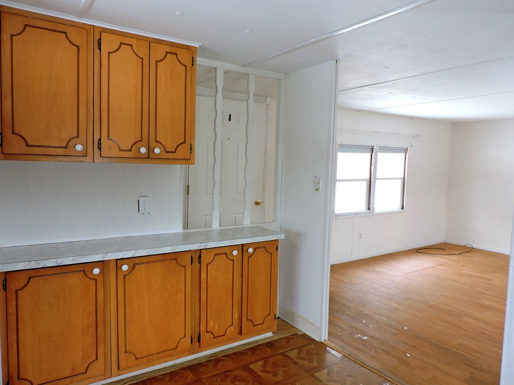 46 Madden Road, Unit 11 West Brookfield, MA 01585 - Photo 4 of 10 a view of an entryway with wooden floor