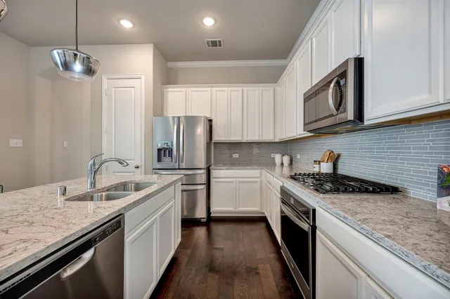 a front view of a house with garage
