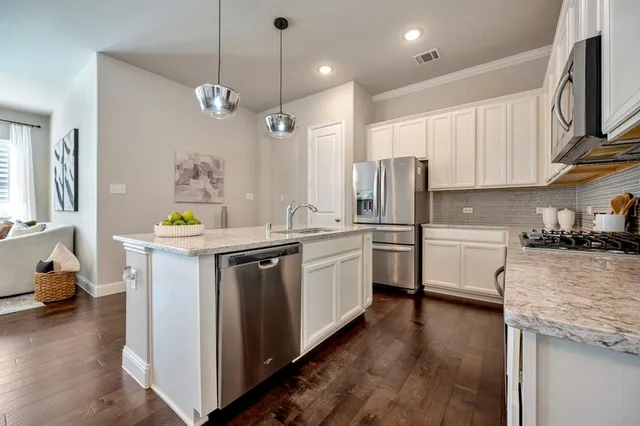 an aerial view of a house with a yard