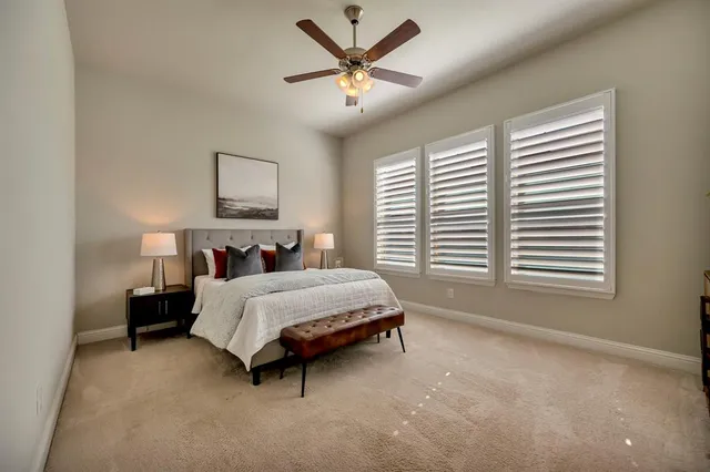 a view of a house with a yard and plants