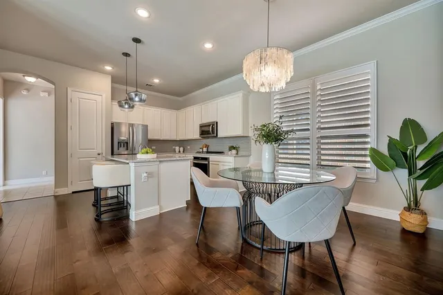 a view of a brick house with a large window
