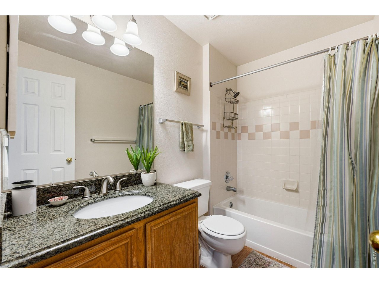 4985 Twin Lakes Road, Unit 94 Boulder, CO 80301 - Photo 15 of 29 The second full bathroom also features a granite-topped vanity.