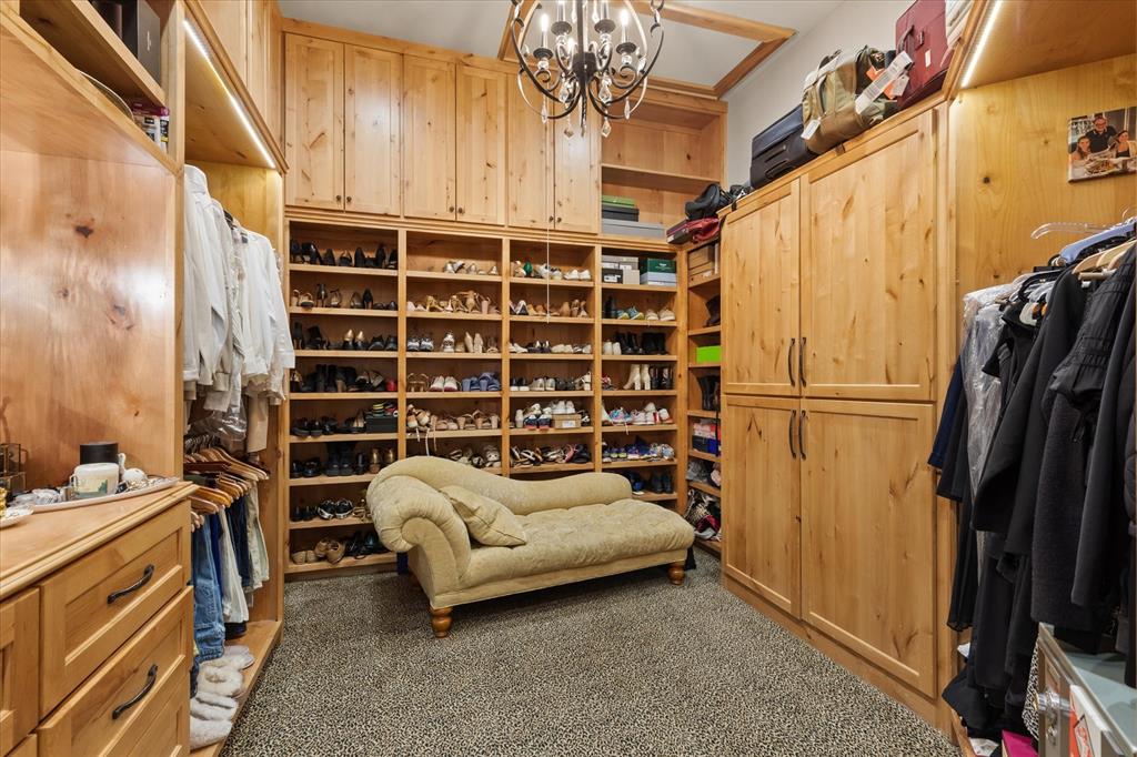 3705 Champions Ridge Lane Longview, TX 75605 - Photo 22 of 40 a view of walk in closet with clothes and shoes