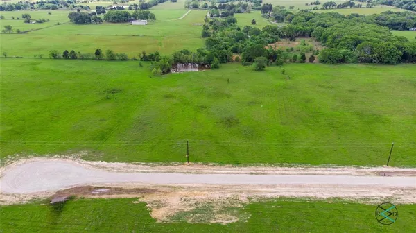 a view of a field with of trees