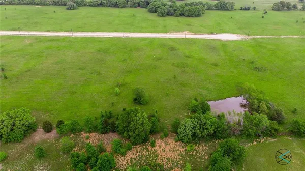 a view of a field with a yard