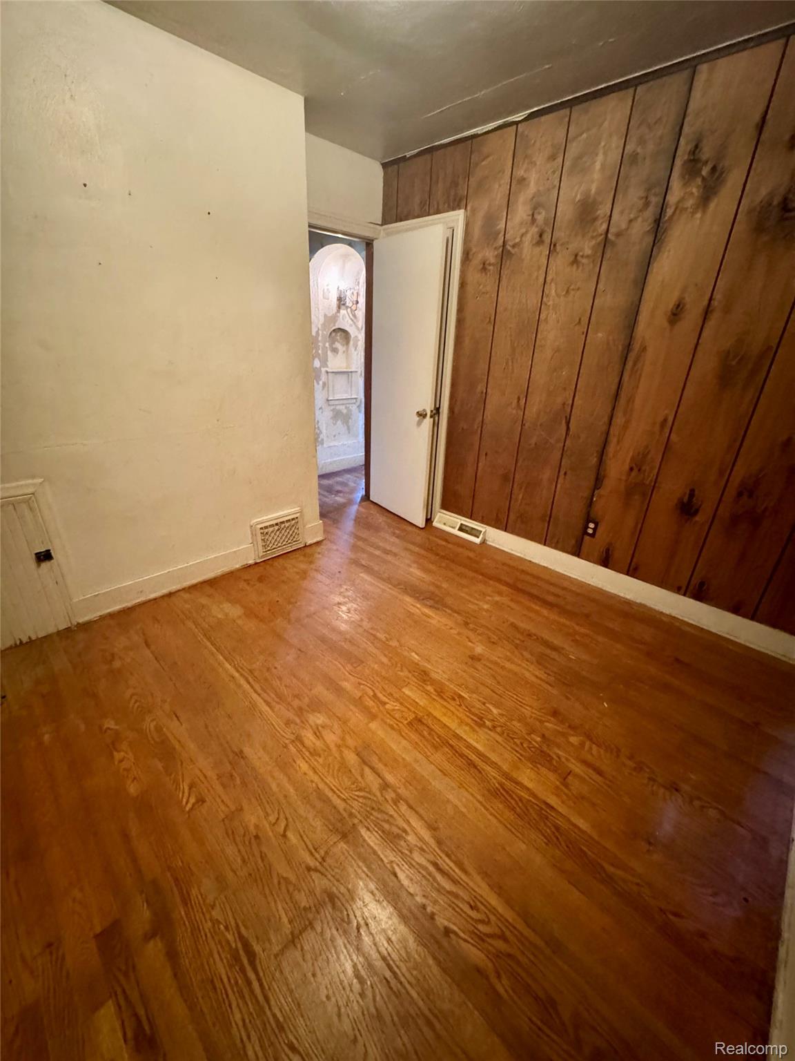 2621 Raskob Street Flint, MI 48504 - Photo 8 of 19 Hardwood flooring with a rich wood tone