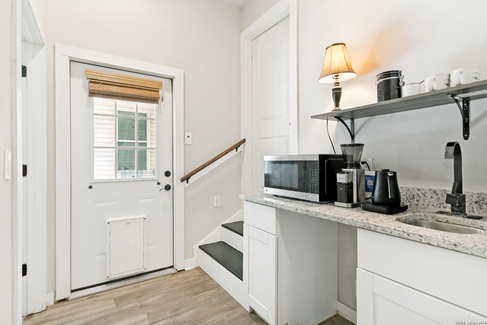 102 Silver Spring Universal City, TX 78148 - Photo 26 of 36 a kitchen with stainless steel appliances a sink and a refrigerator