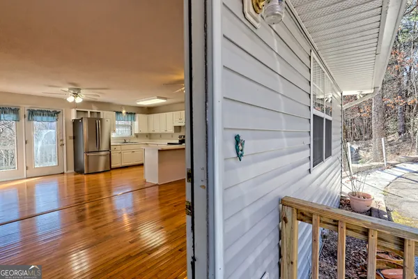 a view of kitchen with cabinets and wooden floor