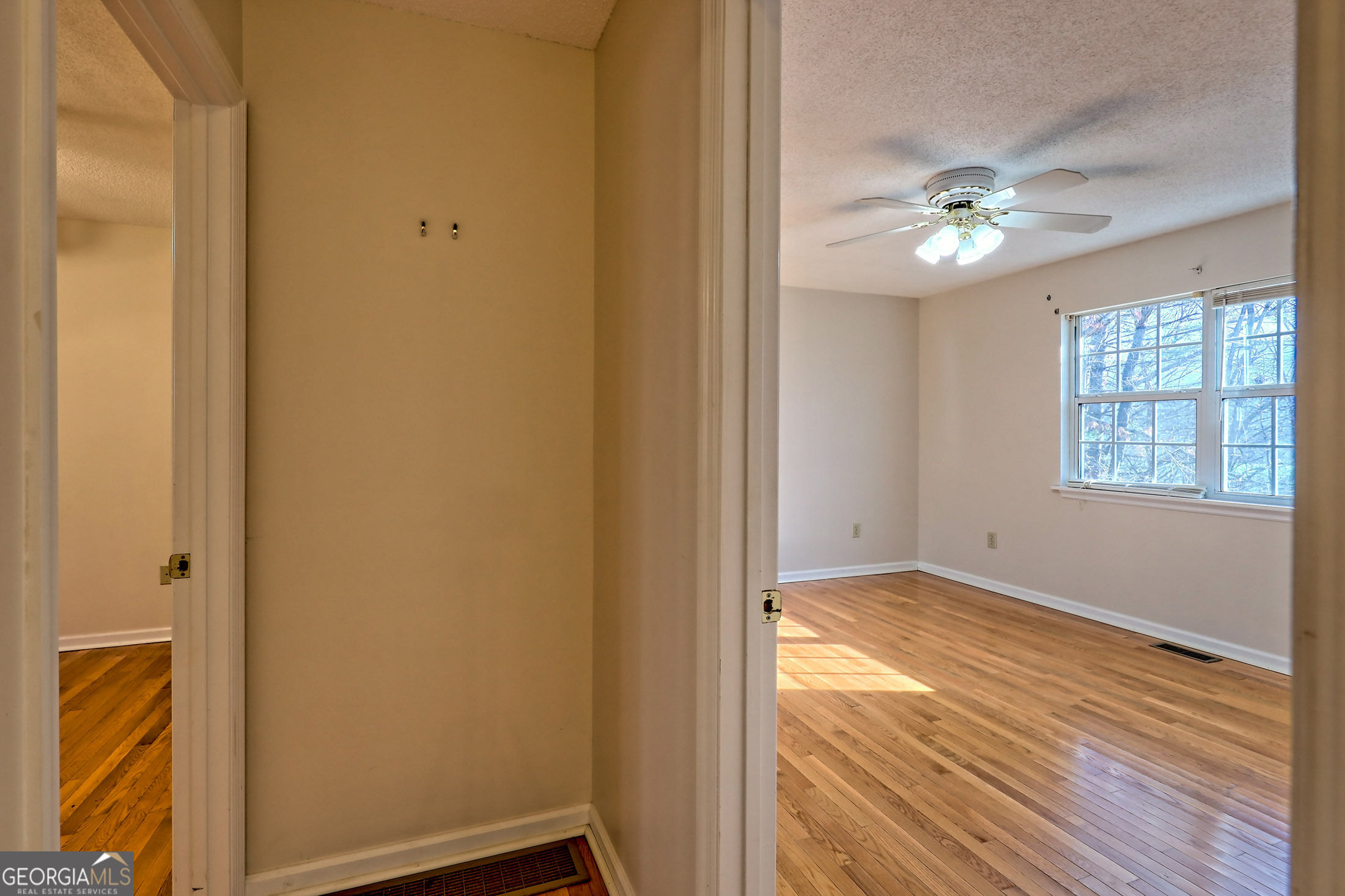 170 White Street Dillard, GA 30537 - Photo 21 of 58 a view of an empty room with wooden floor and a window