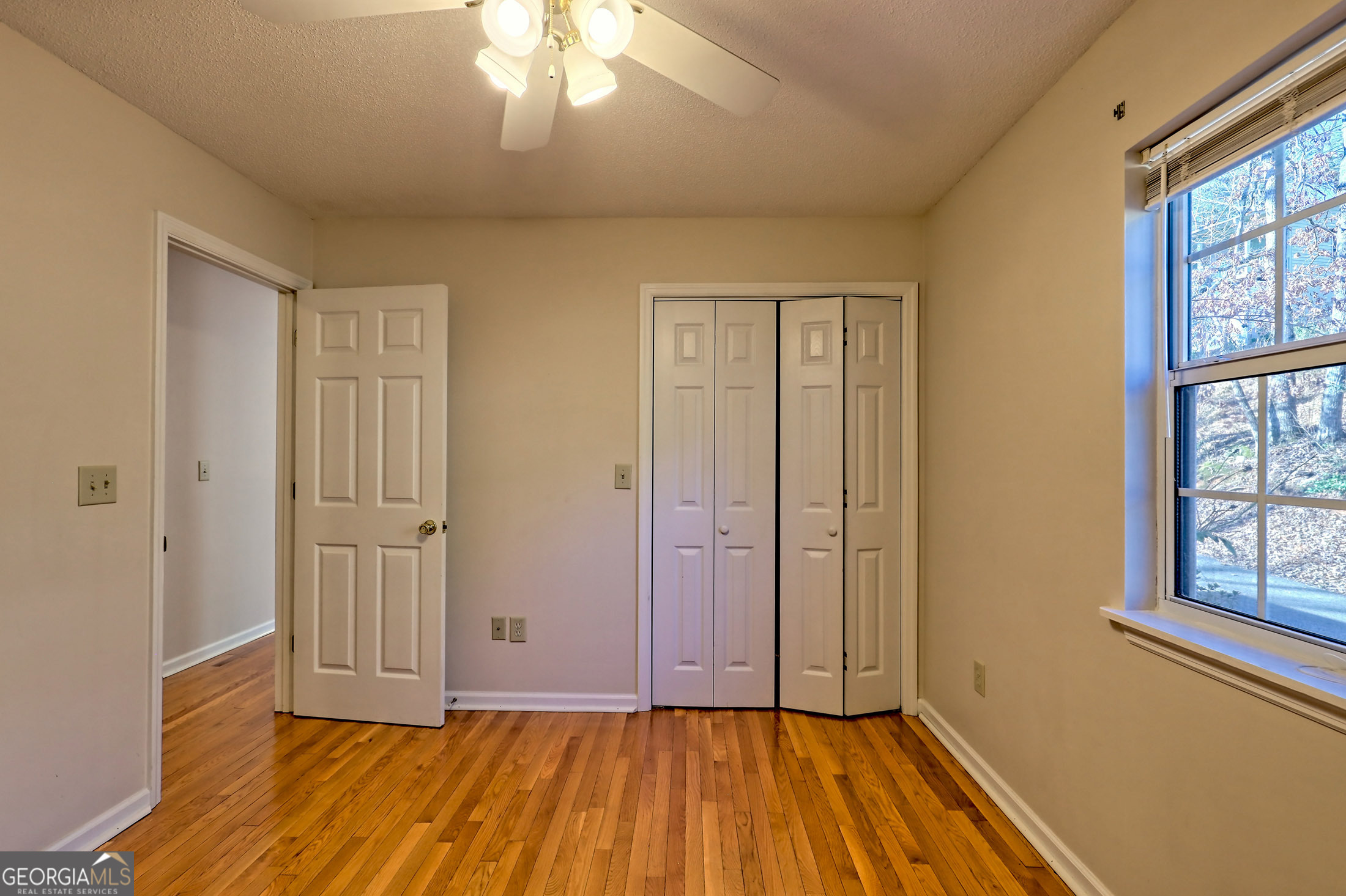 170 White Street Dillard, GA 30537 - Photo 30 of 58 wooden floor in an empty room with a window