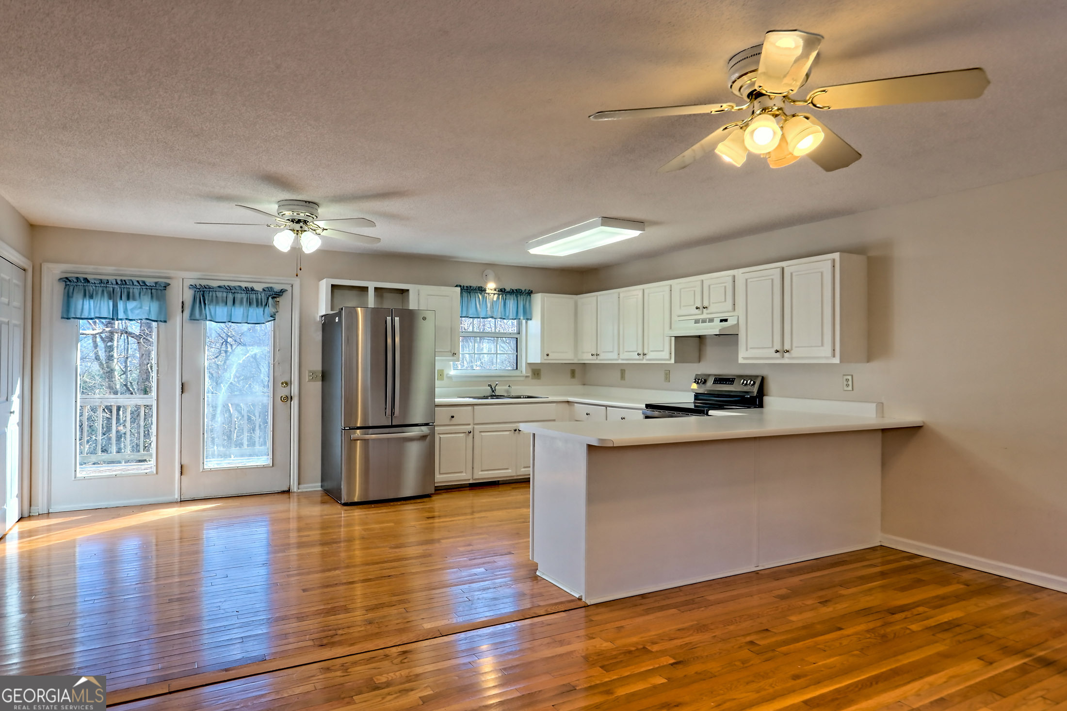 170 White Street Dillard, GA 30537 - Photo 3 of 58 a kitchen with stainless steel appliances granite countertop a refrigerator and a stove top oven