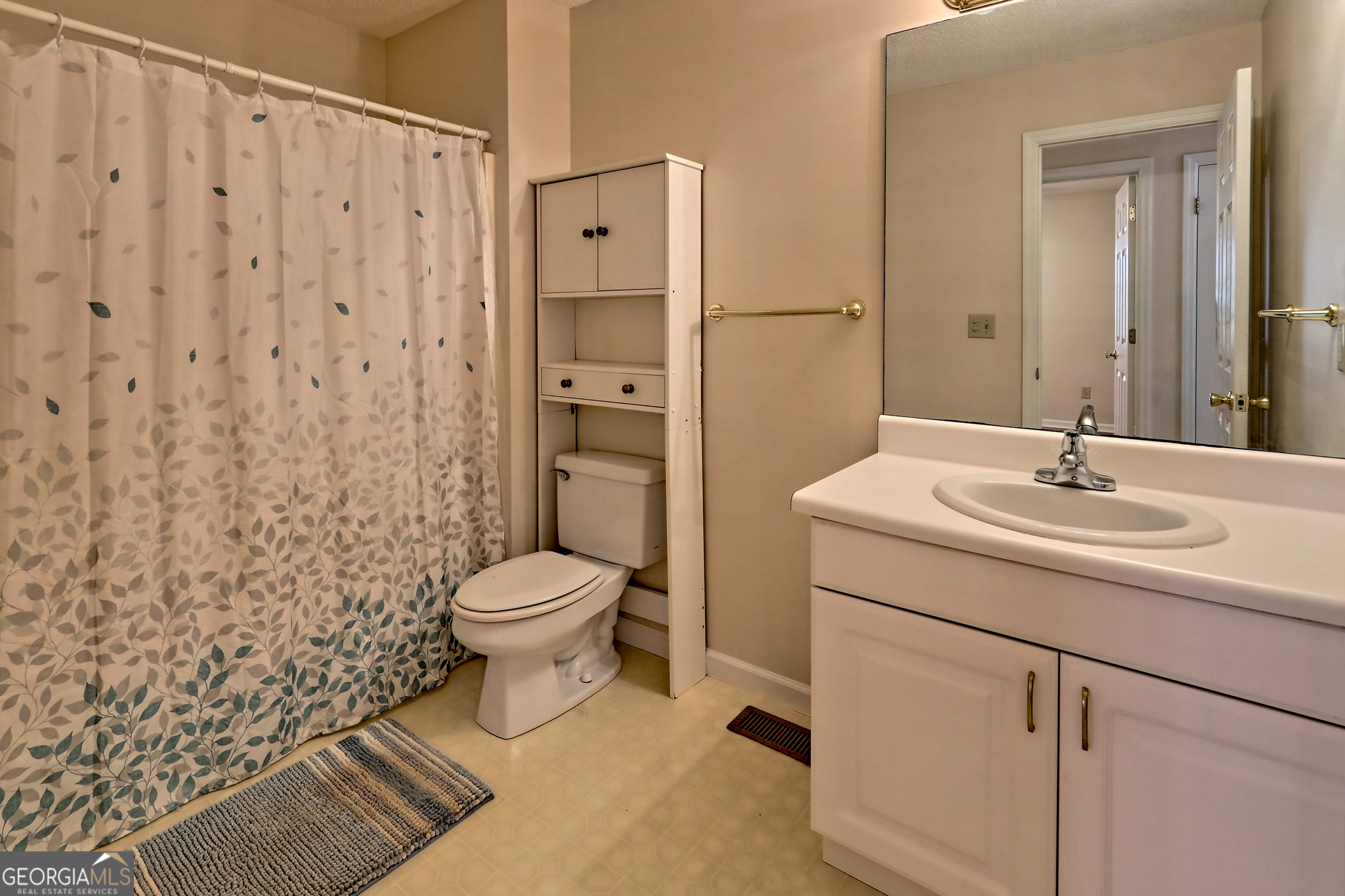 170 White Street Dillard, GA 30537 - Photo 32 of 58 a bathroom with a sink a toilet and shower