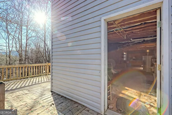 a backyard of a house with a tree