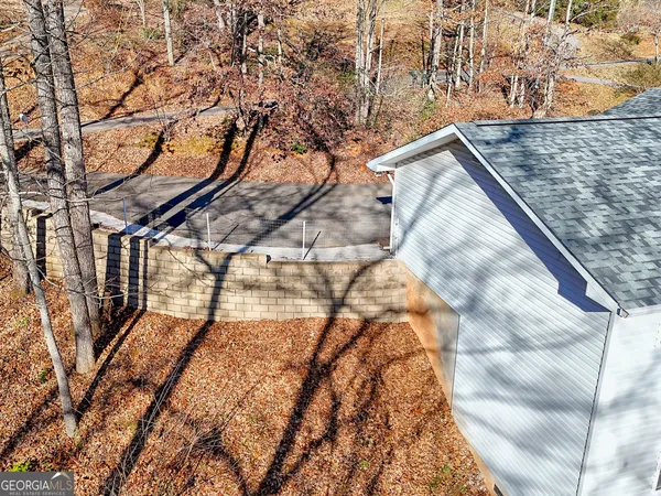 a view of a patio with a table and chairs
