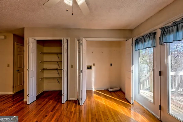a view of room with wooden floor and window
