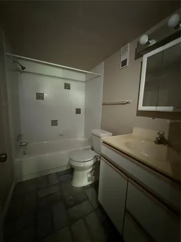 a view of a pathway with a garden