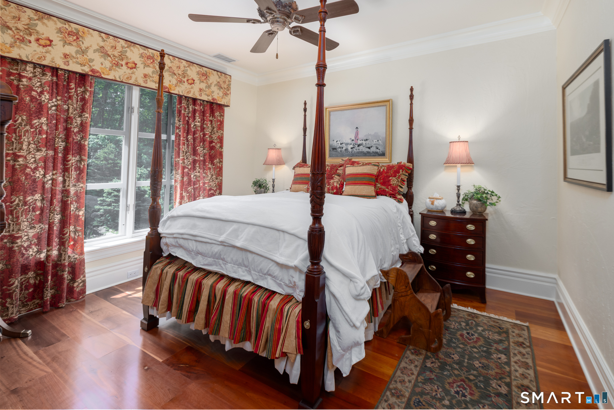7 Equestrian Ridge Newtown, CT 06470 - Photo 36 of 40 a bedroom with a bed and wooden floor