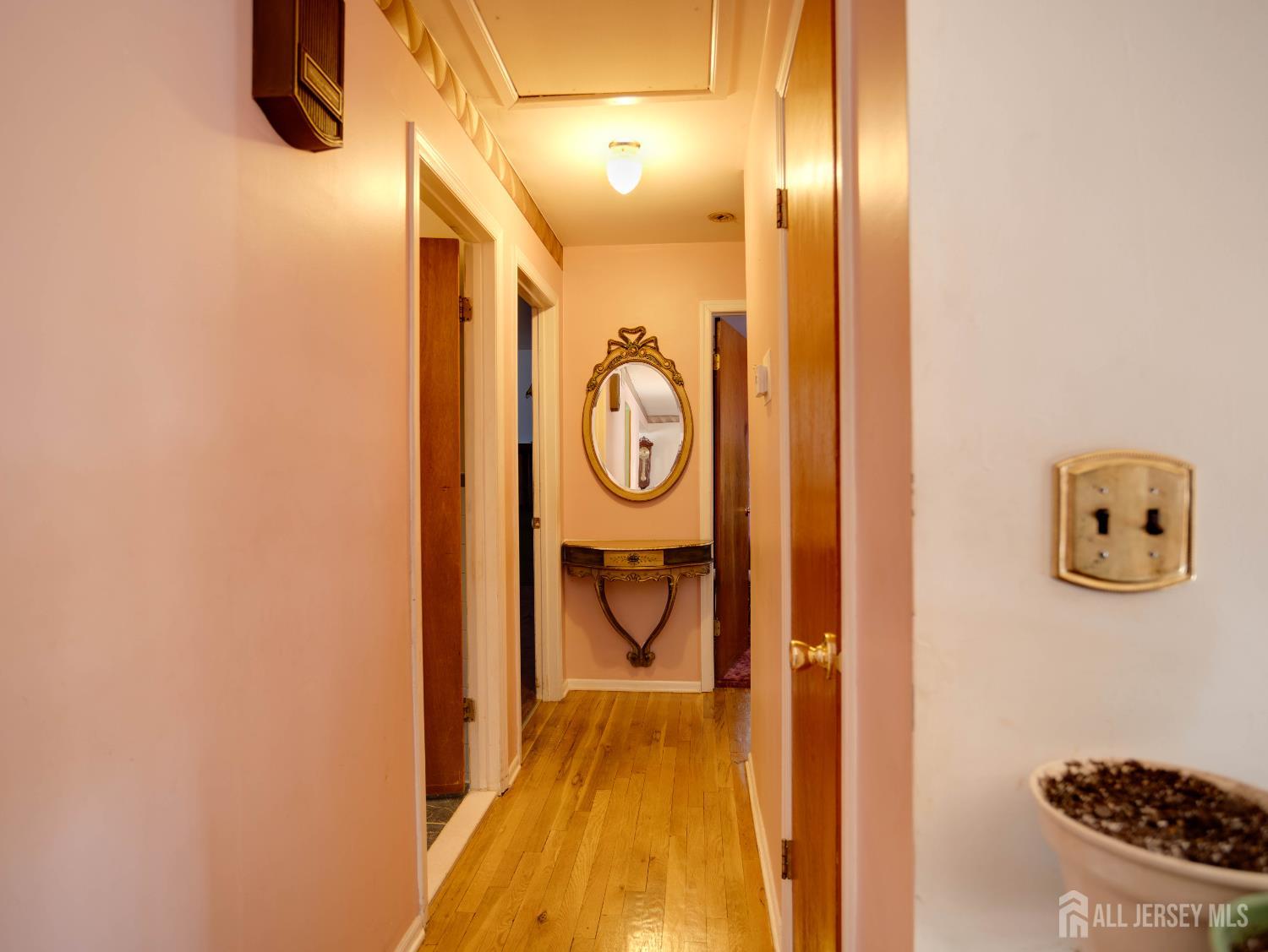 15 East Walnut Street Colonia, NJ 07067 - Photo 13 of 23 a view of a hallway with painted walls