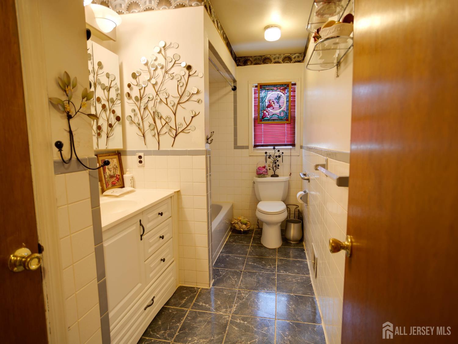 15 East Walnut Street Colonia, NJ 07067 - Photo 18 of 23 a bathroom with a sink toilet and shower