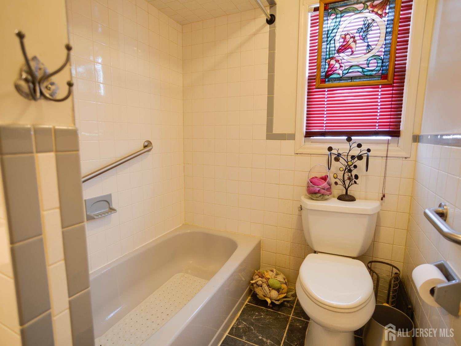 15 East Walnut Street Colonia, NJ 07067 - Photo 19 of 23 a bathroom with a toilet and a shower
