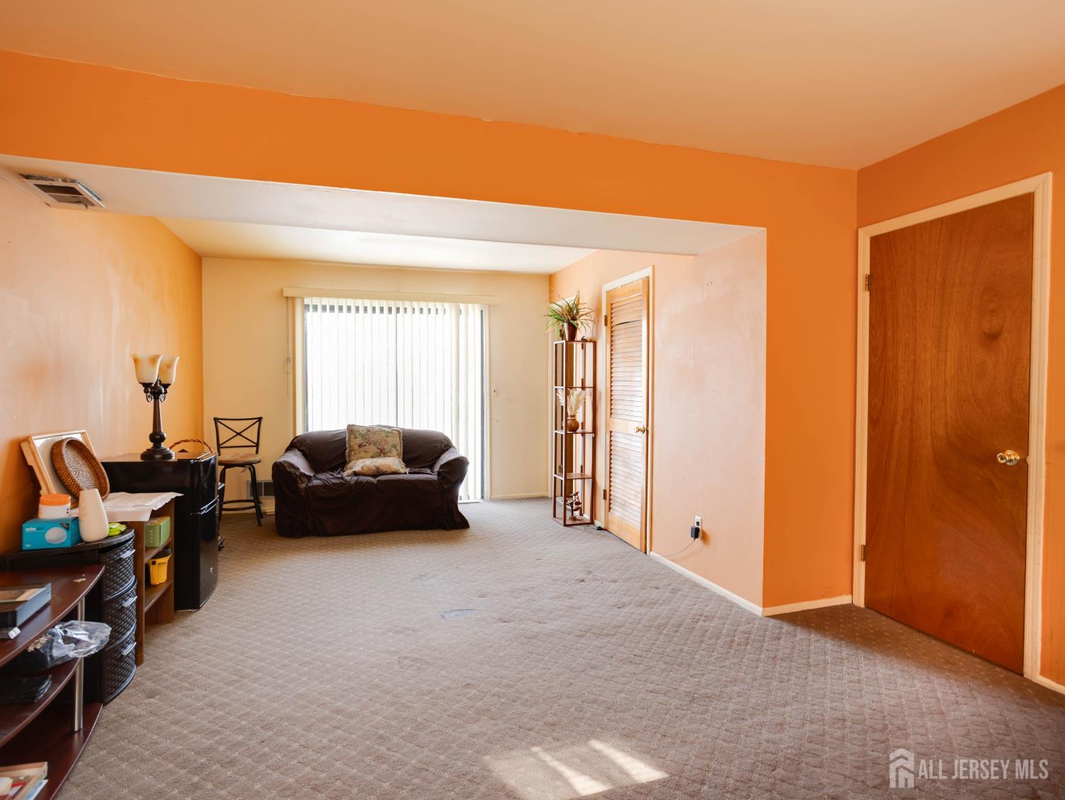 15 East Walnut Street Colonia, NJ 07067 - Photo 21 of 23 a living room with furniture and a window