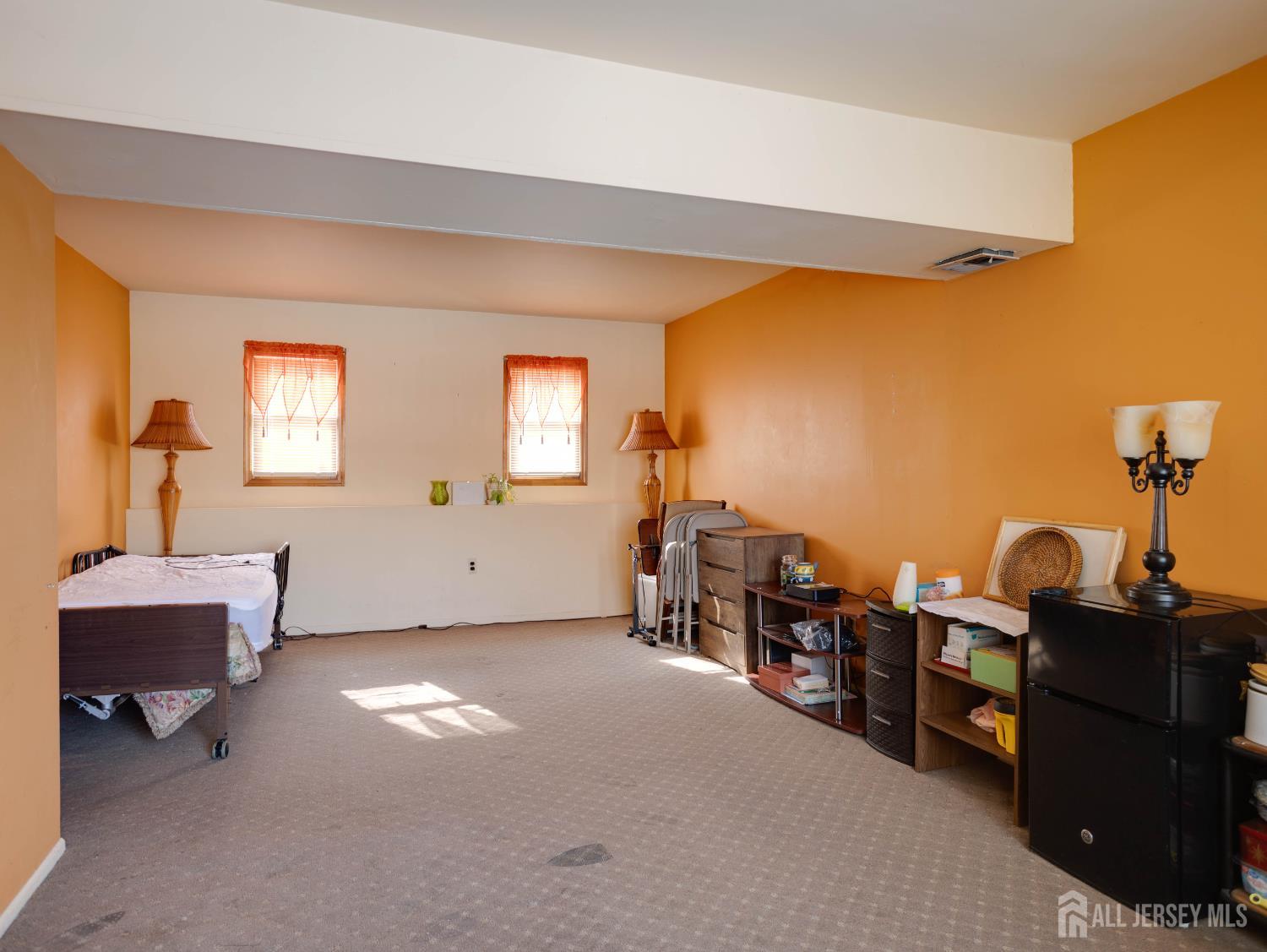15 East Walnut Street Colonia, NJ 07067 - Photo 22 of 23 a view of a livingroom with furniture and windows