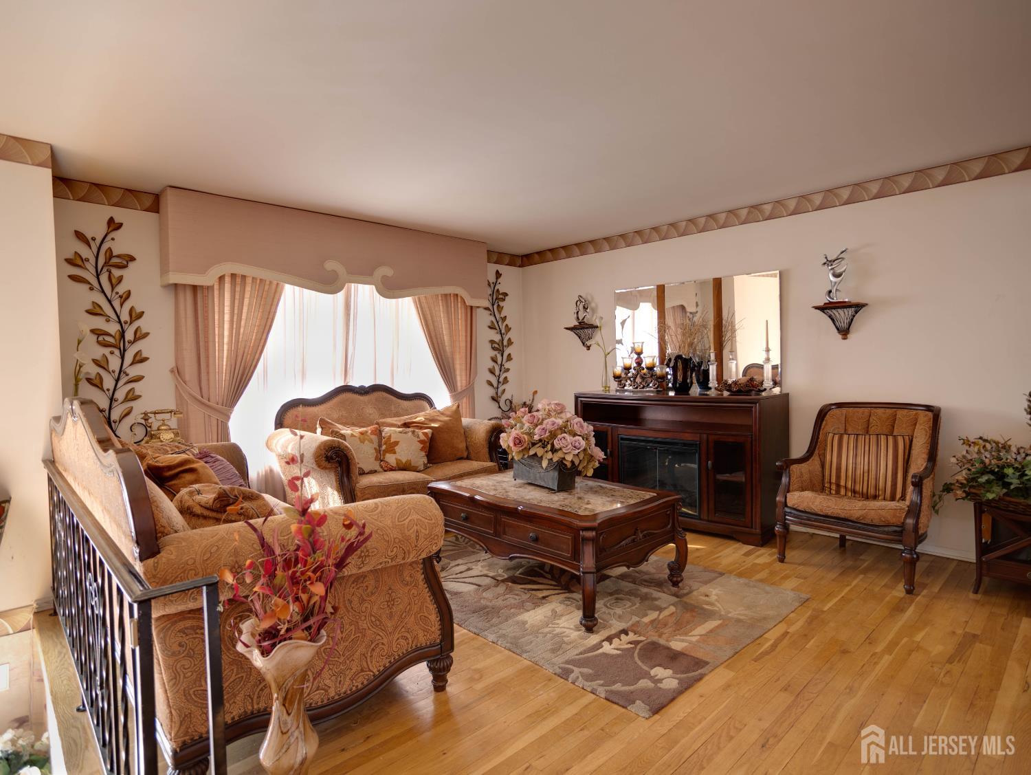 15 East Walnut Street Colonia, NJ 07067 - Photo 3 of 23 a living room with furniture and wooden floor