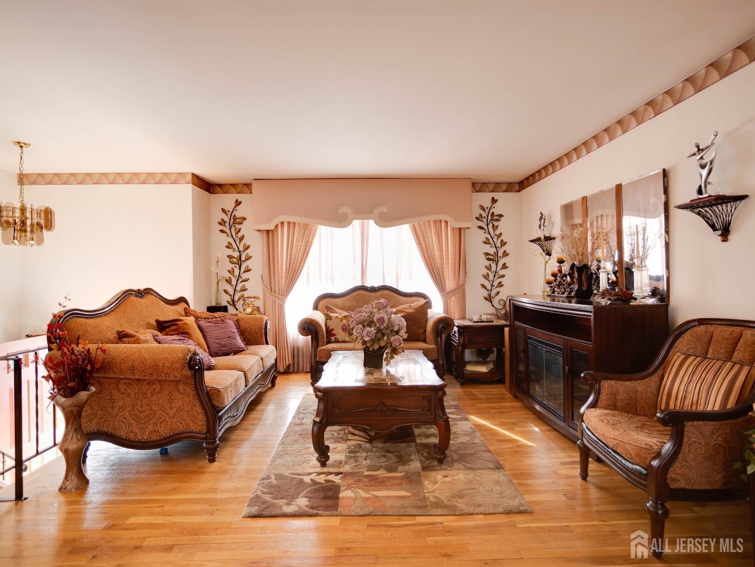 15 East Walnut Street Colonia, NJ 07067 - Photo 4 of 23 a living room with furniture and a wooden floor