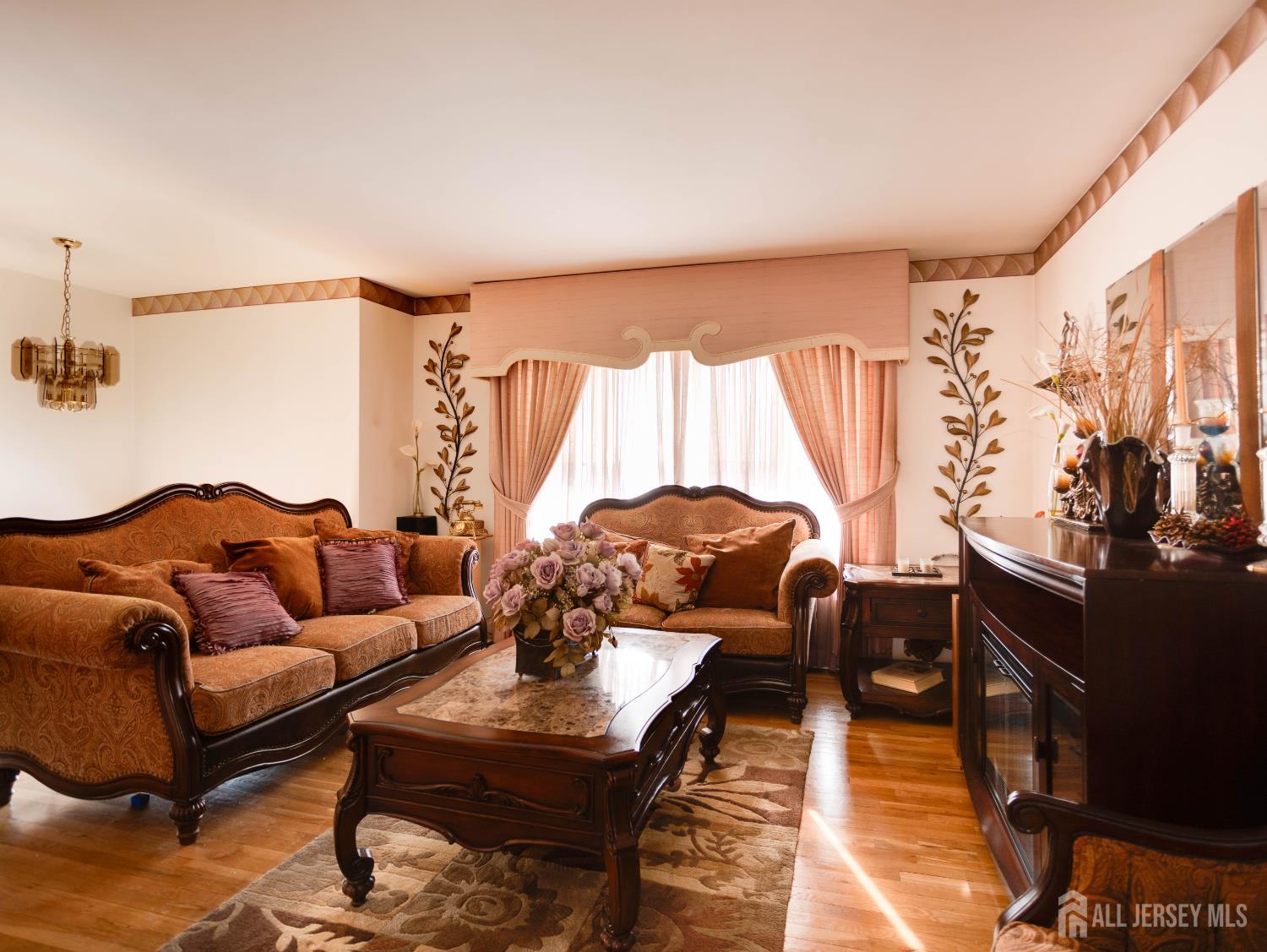15 East Walnut Street Colonia, NJ 07067 - Photo 5 of 23 a living room with furniture and a large window