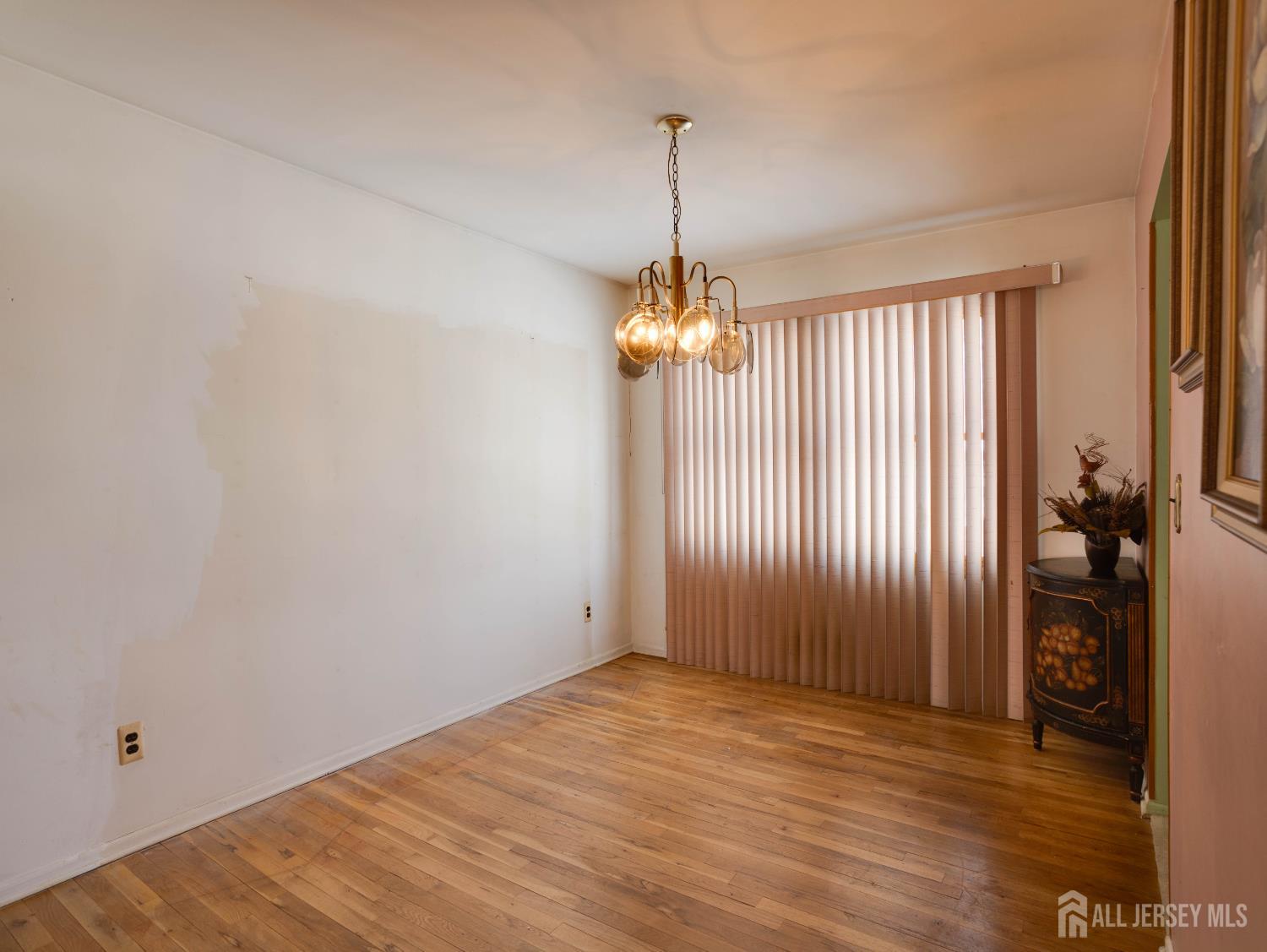 15 East Walnut Street Colonia, NJ 07067 - Photo 6 of 23 wooden floor in an empty room with a window