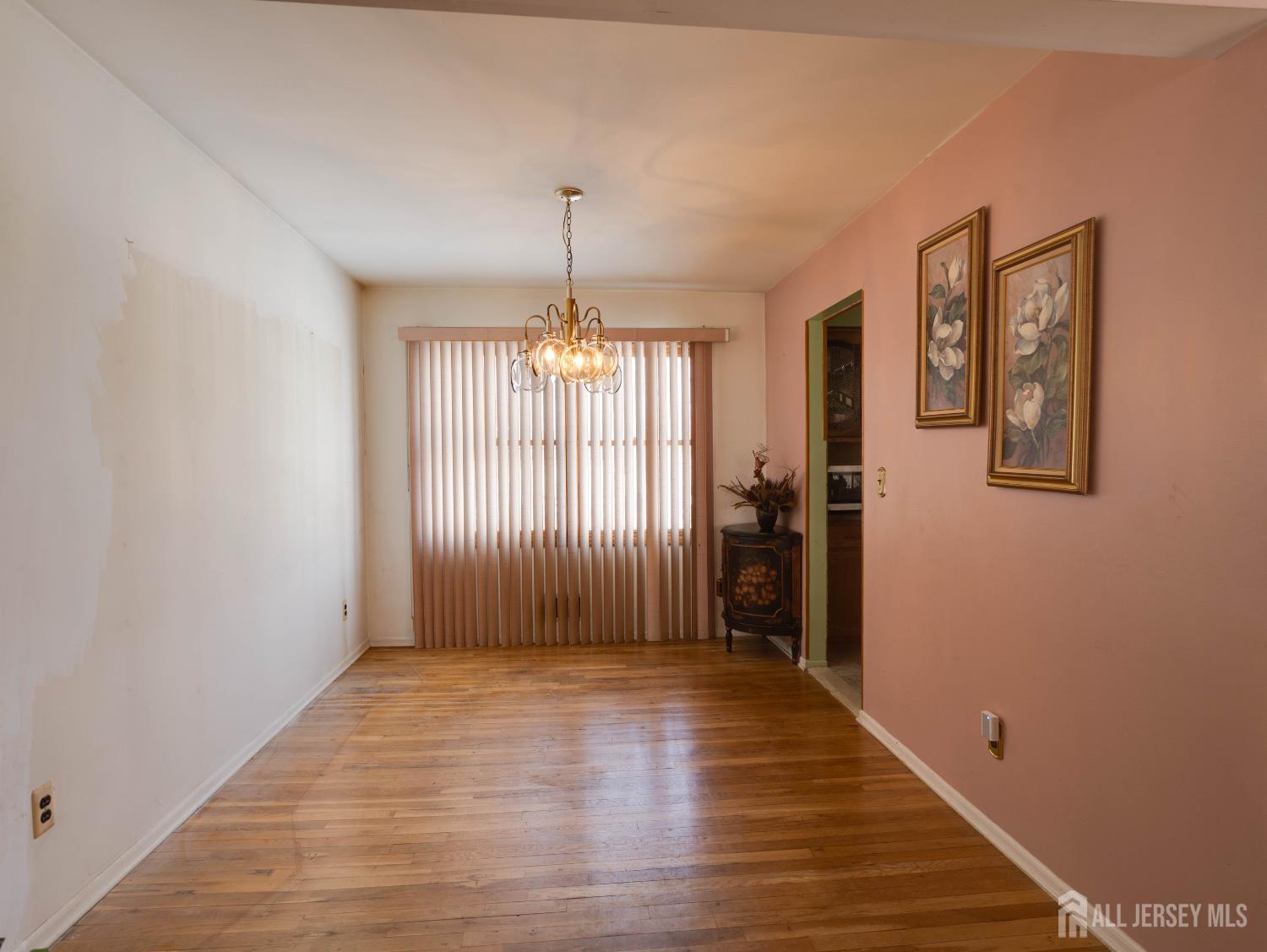 15 East Walnut Street Colonia, NJ 07067 - Photo 7 of 23 a view of empty room with wooden floor