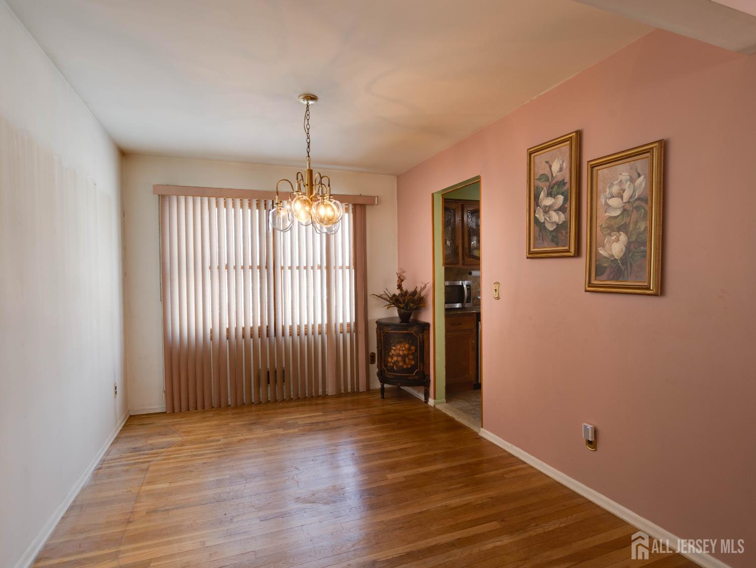 15 East Walnut Street Colonia, NJ 07067 - Photo 8 of 23 a view of empty room with wooden floor and fan