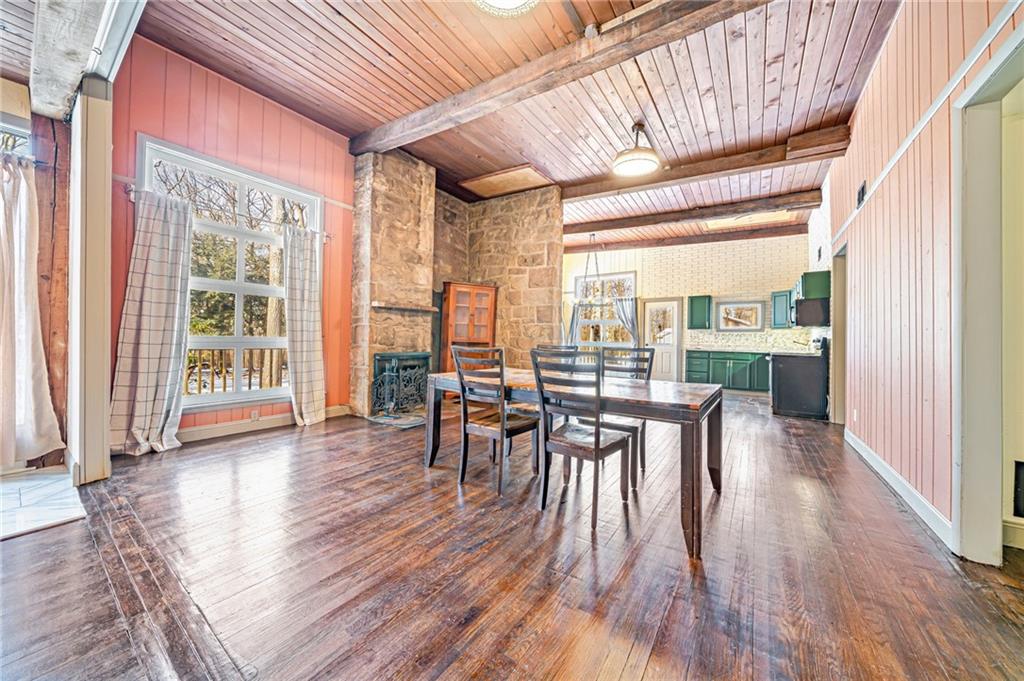 128 Sky Top Road Acme, PA 15610 - Photo 11 of 34 a dining room with furniture window wooden floor