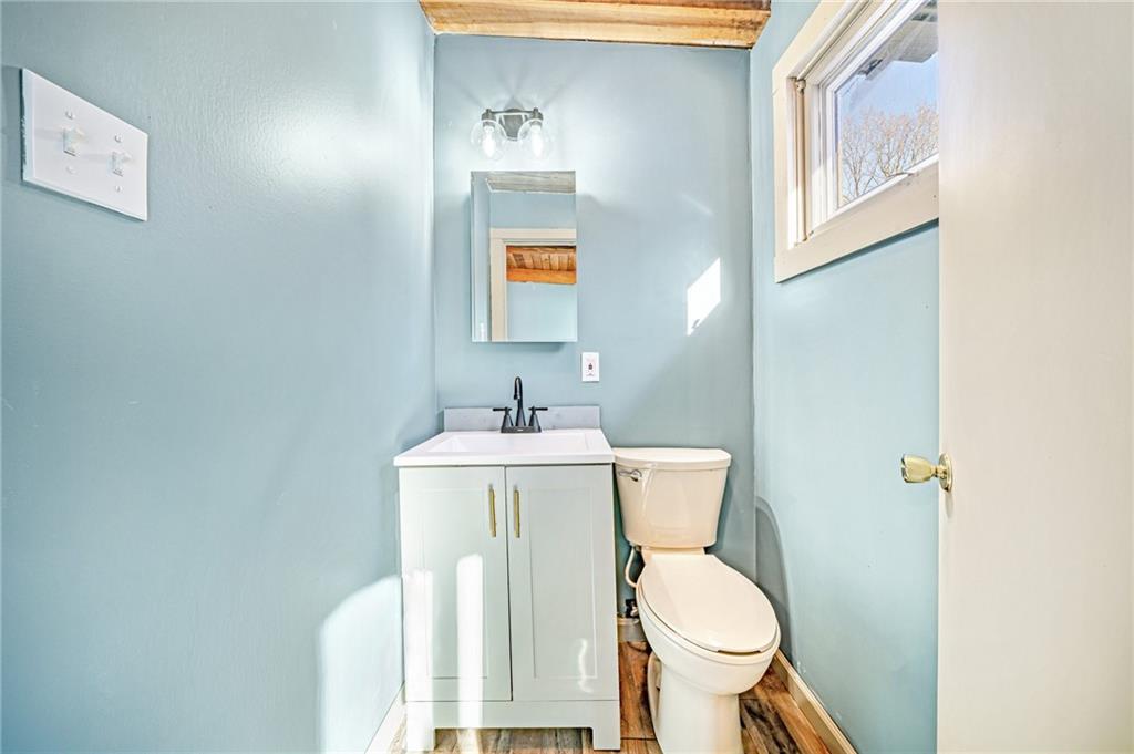 128 Sky Top Road Acme, PA 15610 - Photo 24 of 34 a white toilet sitting next to a bathroom sink