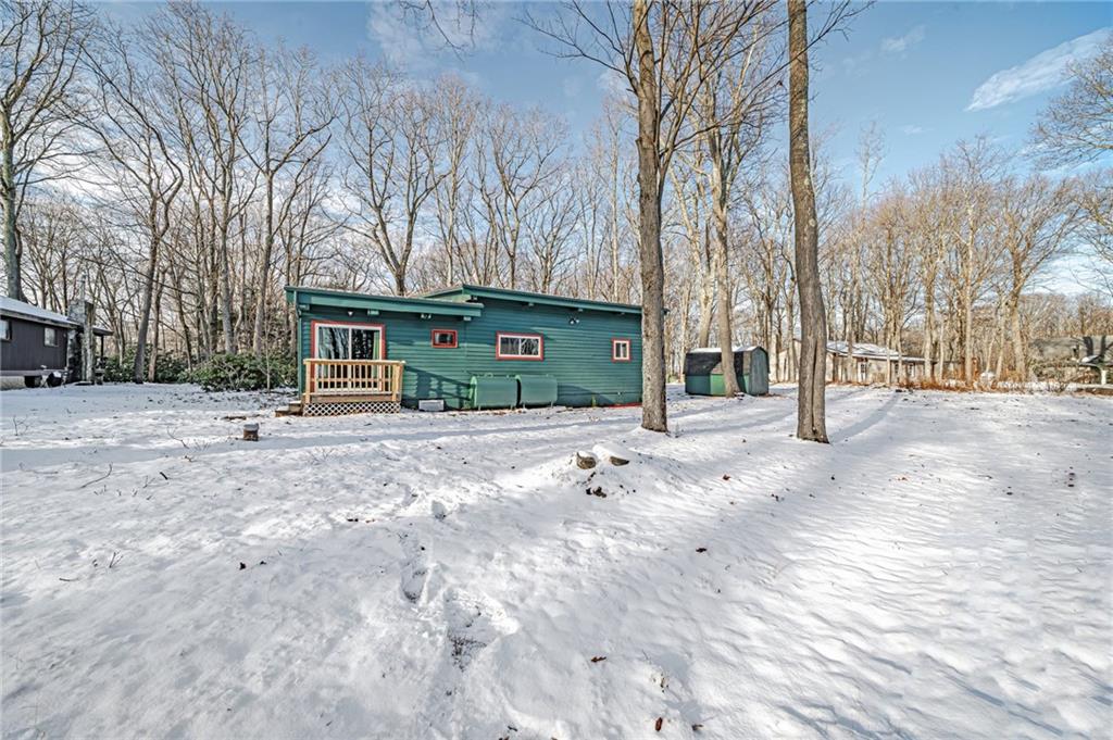 128 Sky Top Road Acme, PA 15610 - Photo 3 of 34 a view of house with a yard covered in snow